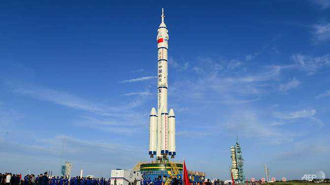 Rocket blasts off carrying first Chinese crew to new space station