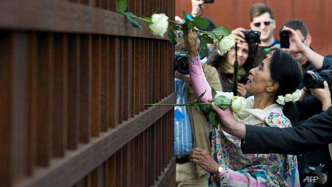Myanmar protesters wear flowers to mark Aung San Suu Kyi's birthday