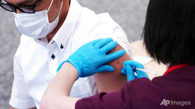 Companies give COVID-19 vaccines to workers, boosting Japan's rollout