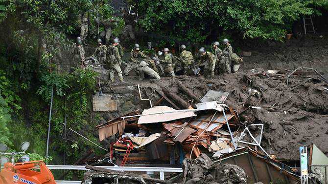 Rescuers struggle to locate dozens in landslide-hit Japan town