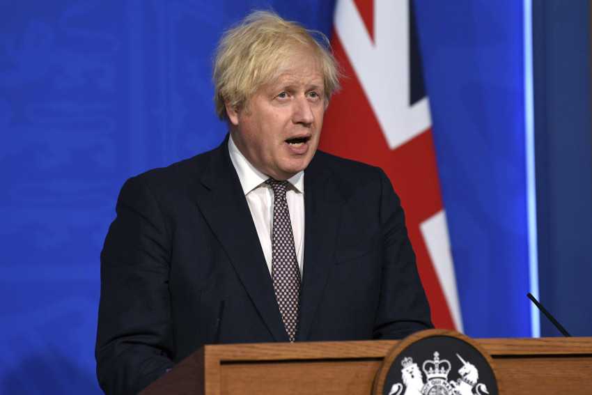 Johnson says UK must live with virus as he eases restrictions