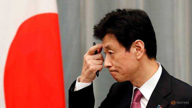 Japan economy minister defends his job after COVID-19 lockdown criticism