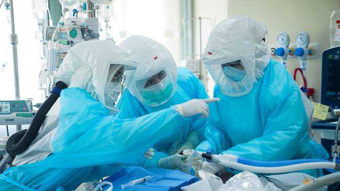 As COVID-19 cases surge, Thai hospital uses containers to store bodies