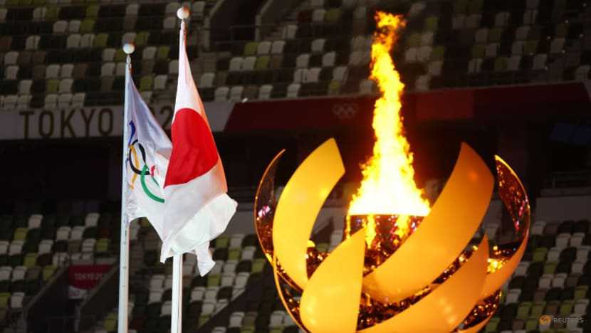 Japan to douse Olympic flame of Games transformed by pandemic and drama