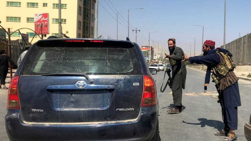 Taliban impose some order around Kabul airport, say witnesses