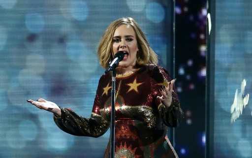 Adele storms back to top of UK charts with comeback single