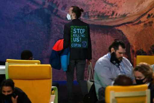 Green groups decry COP26 'shambles' as observers locked out