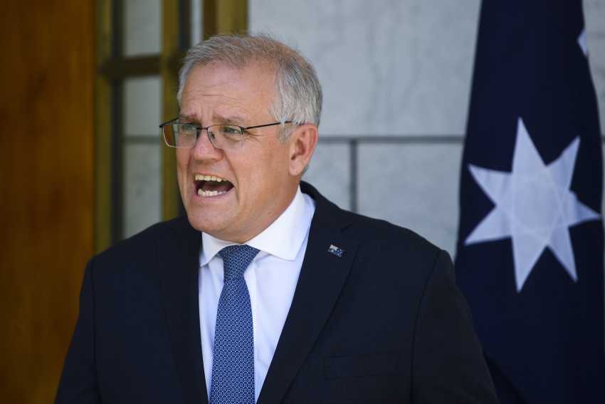 Australian PM meets with state leaders as virus cases surge