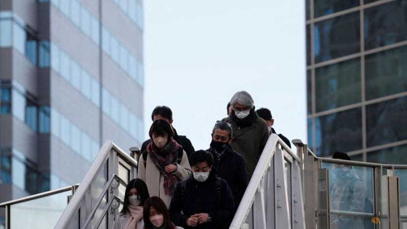 Japan poised to widen COVID-19 controls as Omicron drives record infections