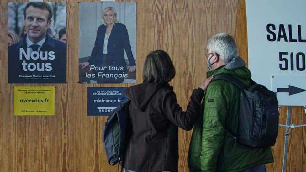 French vote as Macron aims to beat far-right Le Pen