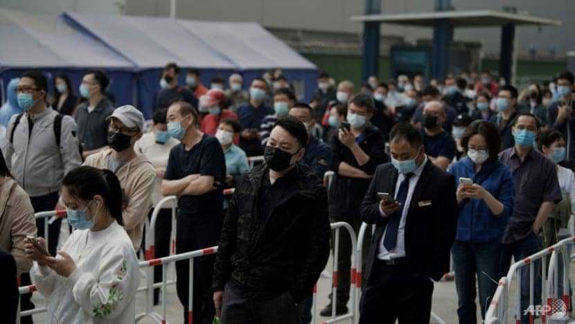 Beijing COVID-19 spike prompts mass testing, panic buying