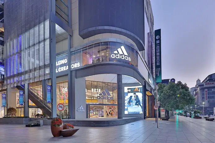 Adidas lowers full year outlook on slow China recovery