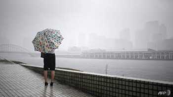 Typhoon slams into Japan, approaches disaster-hit regions
