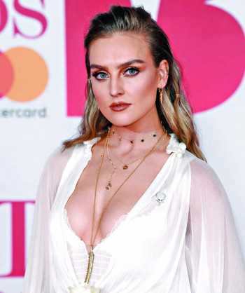 Perrie Edwards' learning to love her freckles
