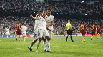 Real stroll past Roma, City lose to Lyon
