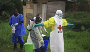 Battles over safe burials complicate Ebola fight