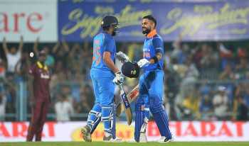 Kohli, Sharma tons crush West Indies in 1st ODI