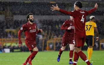 Liverpool seal Christmas top spot as Salah and Van Dijk sink Wolves