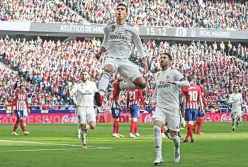 Real overtake Atletico with derby victory