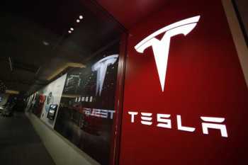 Tesla shares rise after it posts record $3.3bn profit in first quarter