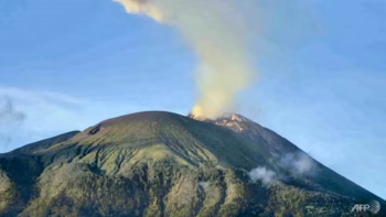 Indonesia volcano erupts, spews tower of smoke and ash