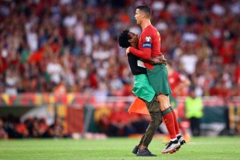 Ronaldo Picked Up By Pitch Invader In Portugal Win