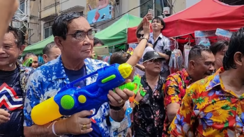 Thai PM Prayut gets a drenching in surprise water fight appearance