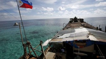 China allows Philippines to supply troops at disputed reef